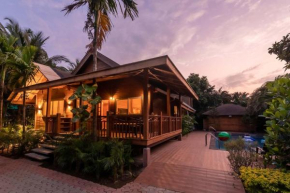 Nature's Abode - The Wooden Villa at Morjim by StayVista